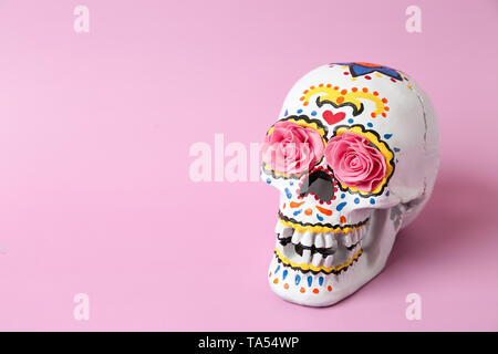 Painted human skull for Mexico's Day of the Dead on color background Stock Photo