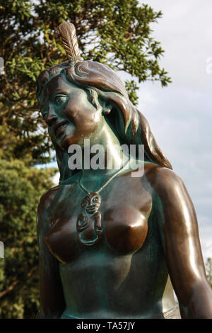 Portrait of the iconic bronze Statue of the Maori Girl, Pania of the Reef in Napier, New Zealand Stock Photo