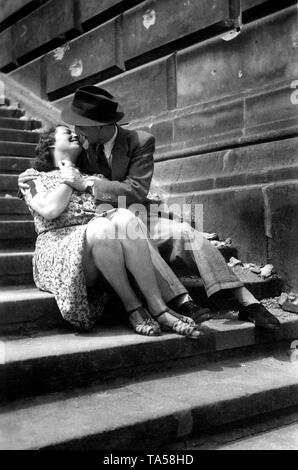 Couple, Lovers, man kissing woman on the stairs, around 1920, Germany Stock Photo
