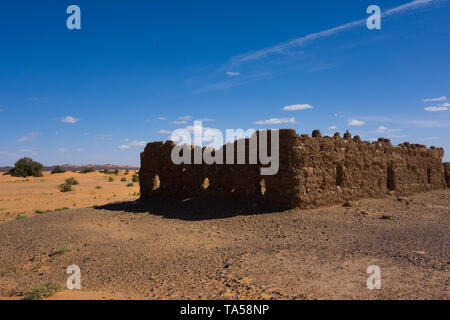 Ruined house in the small village Sahara desert near Merzouga, Morocco Stock Photo