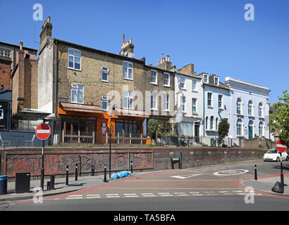 Forest Hill, south London, UK. A Victorian terrace of shops and houses on the raised pavement at the junction of Devonshire Road and David's Road. Stock Photo