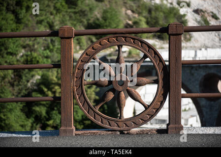 Ponti di Vara. in the middle of Carrara marble basins. The wheel is the city symbol Stock Photo