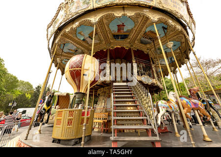Shot of classic style colorful spinning merry-go-round in Paris, France.  Avenue Gustave V de Suède, just next to the Warsaw Fountains and in front of Stock Photo