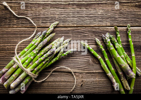 Fresh organic asparagus, green vegetables on farmer market, freshly harvested vegetable, top view Stock Photo