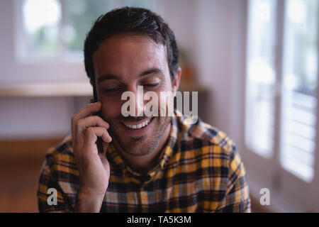 Man executive talking on mobile phone in the office Stock Photo