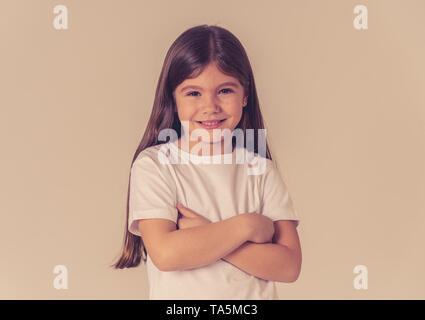 Cute happy, confident, successful, proud little girl smiling at the camera. Positive human emotions and facial expressions, children and education con Stock Photo