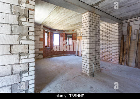 empty interior in house without repair with white silicate brick walls Stock Photo
