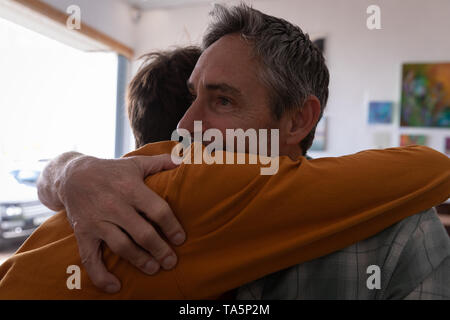 Father and son embracing each other Stock Photo