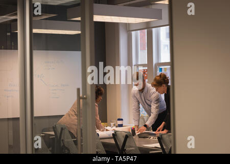 Business people discussing with each other in a meeting Stock Photo