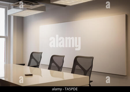 Empty chairs and table at conference room Stock Photo
