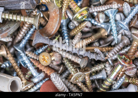 Metal screws of different diameters, new and old, second-hand Stock Photo
