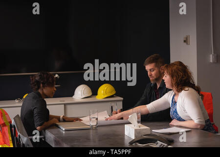 Architect business people working at blueprint and business plan Stock Photo