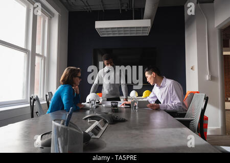 Architect business people working at blueprint and business plan Stock Photo