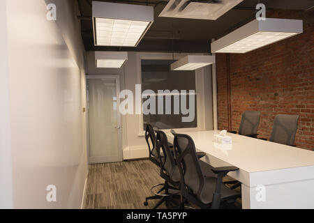 Empty chairs and table at conference room Stock Photo