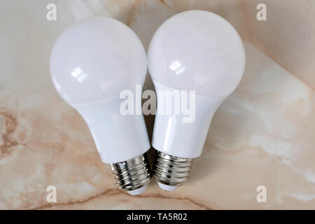 Lighting electric lamps for living rooms LED close-up lie on the table Stock Photo