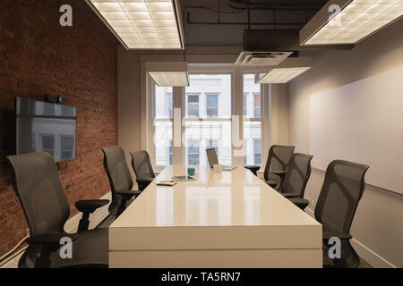 Empty chairs and table at conference room Stock Photo