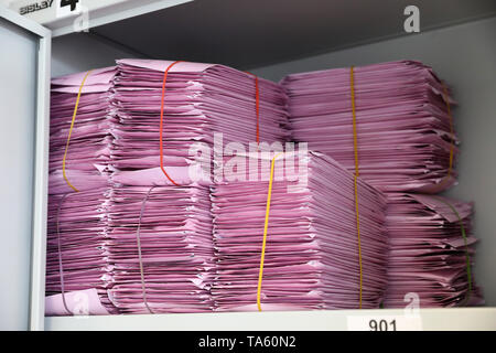 Rostock, Germany. 17th May, 2019. Envelopes with completed ballot papers for the European elections on 26.05.2019 are placed in a cupboard in the electoral roll and postal voting office. The postal ballot is becoming more and more popular. In the 2017 federal elections in Mecklenburg-Western Pomerania, 23.9 percent of all voters cast their votes by letter, compared to 18.2 percent four years earlier. Credit: Bernd Wüstneck/dpa-Zentralbild/ZB/dpa/Alamy Live News Stock Photo