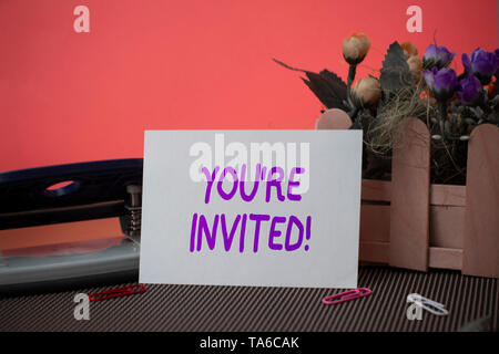 Conceptual hand writing showing You re are Invited. Business photo