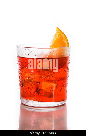 Negroni cocktail with piece of orange in glass isolated on white background. Stock Photo