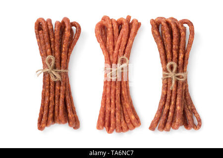 Polish thin Kabanosy sausages in three different flavors close up isolated on white background Stock Photo