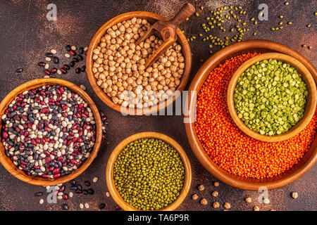 Assortment  of Legumes - lentils, peas, mung, chickpeas and different beans. Top view. Stock Photo