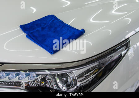 Blue microfiber cloth on the car Stock Photo