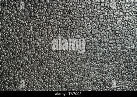 Black metalic polystyrene foam full frame macro shot background Stock Photo