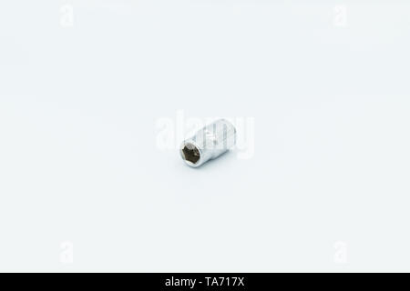 This capture of a silver socket wrench on a white background and in a studio light Stock Photo