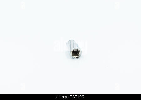 This capture of a silver socket wrench on a white background and in a studio light Stock Photo