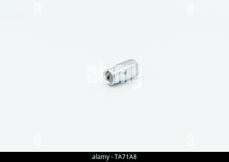 This capture of a silver socket wrench on a white background and in a studio light Stock Photo