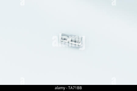 This capture of a silver socket wrench on a white background and in a studio light Stock Photo