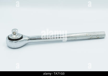 This capture of a silver socket wrench on a white background and in a studio light Stock Photo
