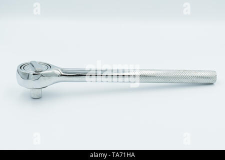 This capture of a silver socket wrench on a white background and in a studio light Stock Photo