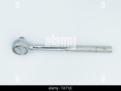 This capture of a silver socket wrench on a white background and in a studio light Stock Photo