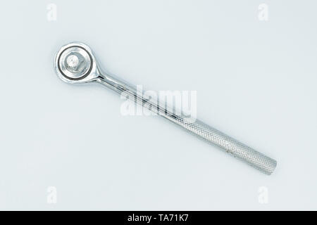 This capture of a silver socket wrench on a white background and in a studio light Stock Photo