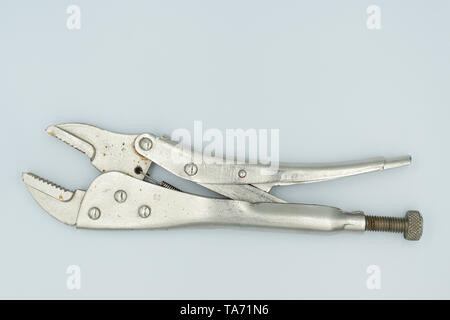 This capture of a silver socket wrench on a white background and in a studio light Stock Photo