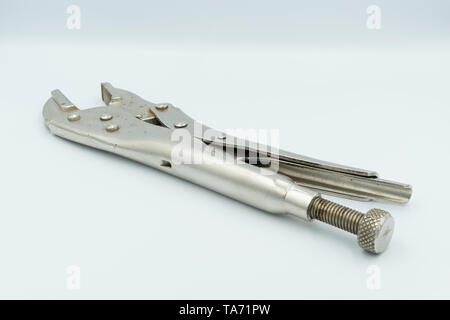 This capture of a silver socket wrench on a white background and in a studio light Stock Photo