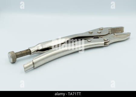 This capture of a silver socket wrench on a white background and in a studio light Stock Photo