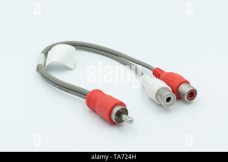 This is a capture for a red and white RCA cable on a white background and a studio light Stock Photo