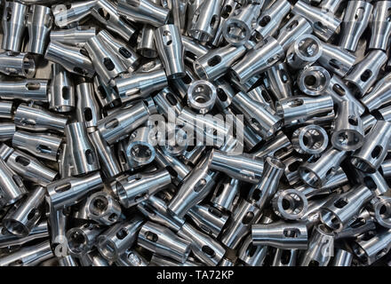 Pile of many engineering parts after turning and machining. Stock Photo