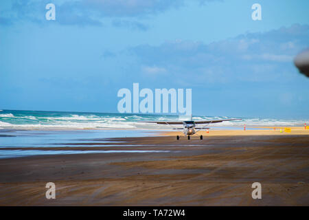 Plane Taking Off At 75 Mile Beach On Fraser Island, Australia Stock Photo
