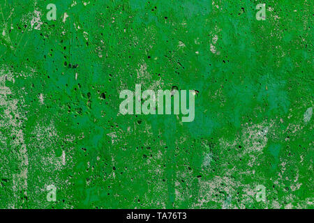 monocolor green painted flat concrete surface closeup texture. Stock Photo
