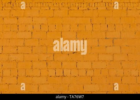 orange plaster rough brick outside wall texture Stock Photo