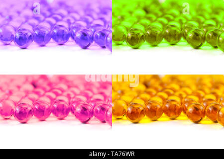 set of colored spherical ball capsules of fish oil selective focus isolated on white background. Stock Photo