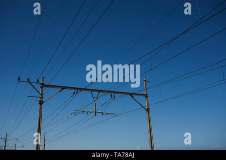Electric train cables overhead Stock Photo