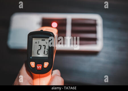 Measuring temperature of charging lithium ion battery pack showing that the temperature rising Stock Photo