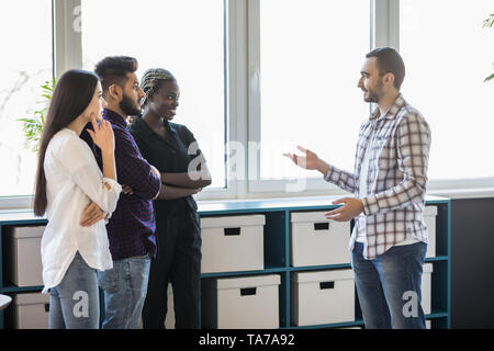 Group Of Businesspeople Having Informal Office Meeting Stock Photo