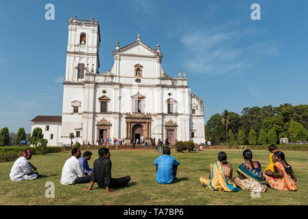 Group of Indian tourists in front of Se Cathedral, Old Goa, India Stock Photo