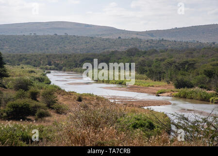 The Black Umfolozi River meandering through the African bush, South Africa. Stock Photo