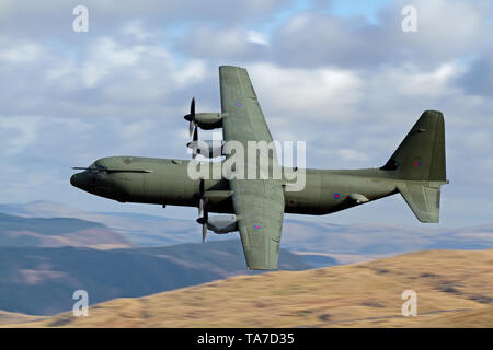 RAF Lockheed C-130 Hercules flying low level in the Mach Loop in Wales, UK